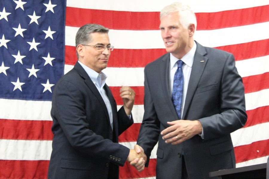 Becerra (left) introduces Umberg (right) to the audience with a warm welcome.