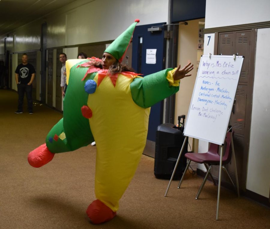 Mrs. Ortiz dancing in clown costume after losing a bet