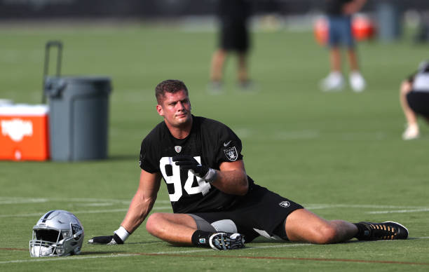 HENDERSON, NEVADA - JULY 29: Carl Nassib #94 of the Las Vegas Raiders stretches out during training camp at the Las Vegas Raiders Headquarters/Intermountain Healthcare Performance Center on July 29, 2021 in Henderson, Nevada. (Photo by Steve Marcus/Getty Images)