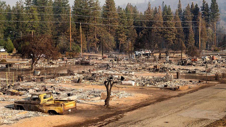 Homes destroyed by the Mill Fire line Wakefield Ave. on Saturday, Sept. 3, 2022, in Weed, Calif. Noah Berger / AP