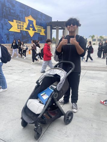 Patrick Medrano with a stroller as his backpack.