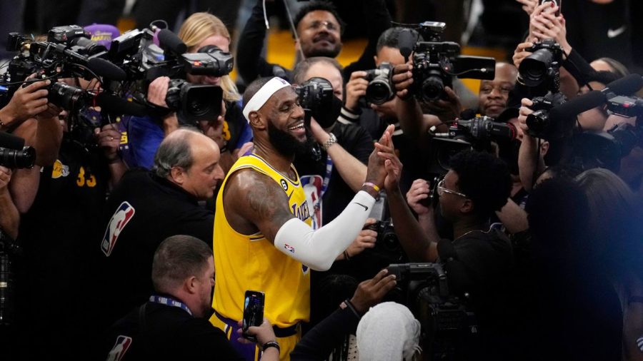 Lebron James celebrating with his son after becoming the NBA All-Time Scoring Leader. (Getty Image)